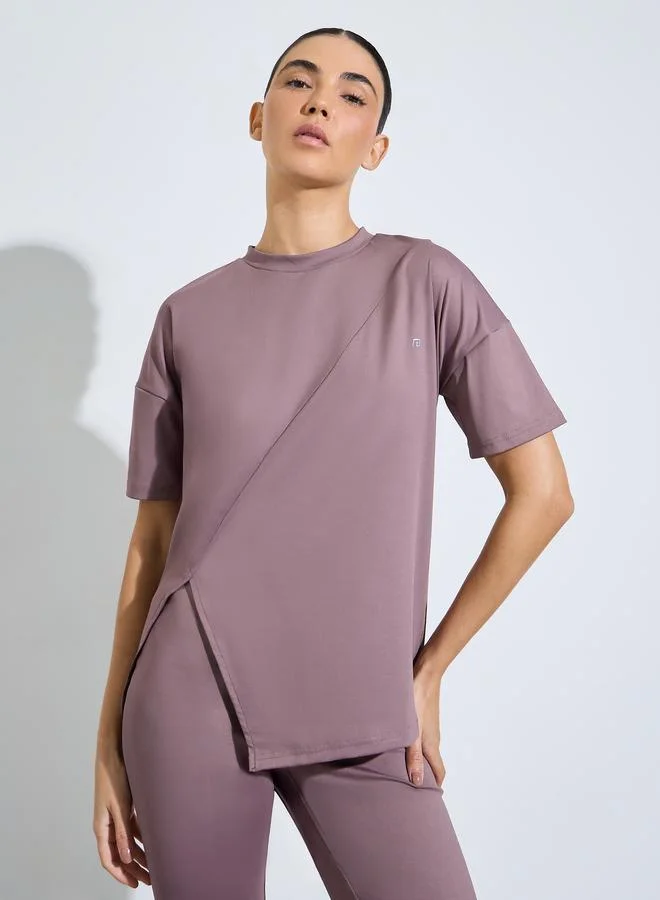 Styli Active Pink Logo Side Slit Top and Ruched Waist Detail Flared Pants Set