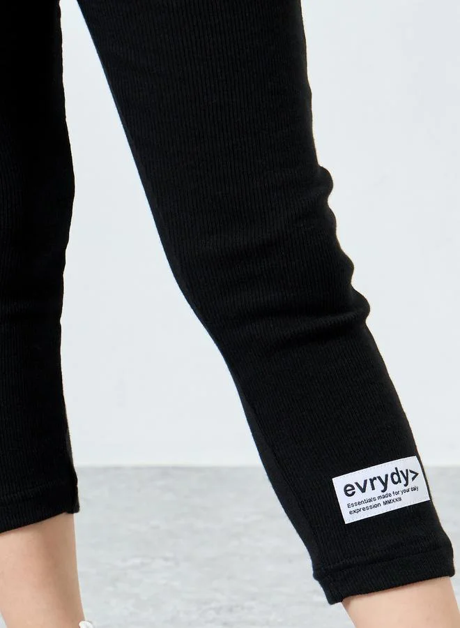 Styli Girls Black Ribbed Leggings with Badge Detail