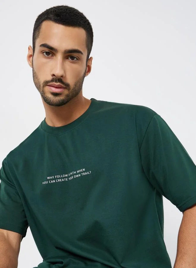 Styli Men Green Slogan Print Oversized T-Shirt
