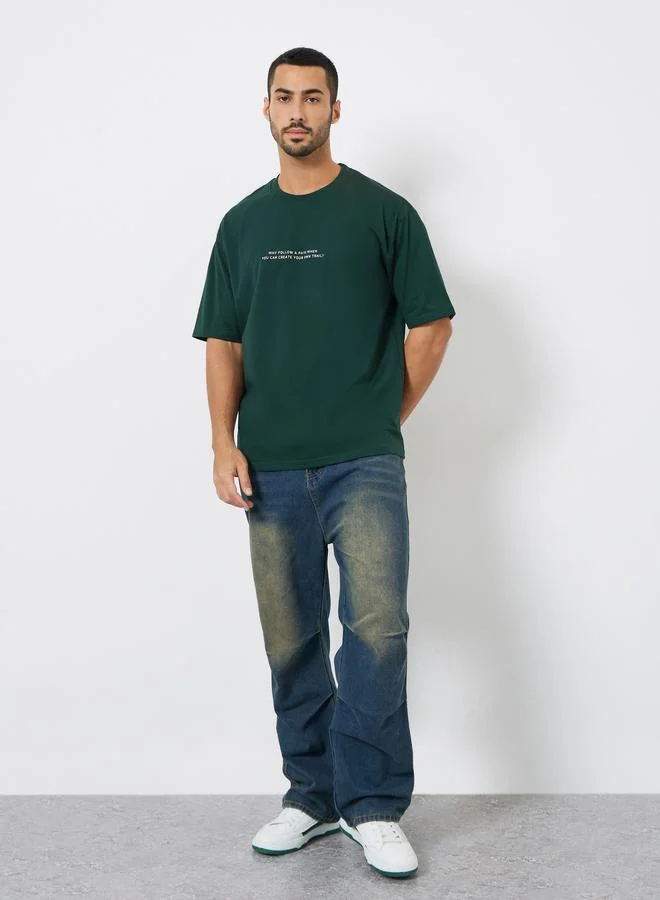 Styli Men Green Slogan Print Oversized T-Shirt
