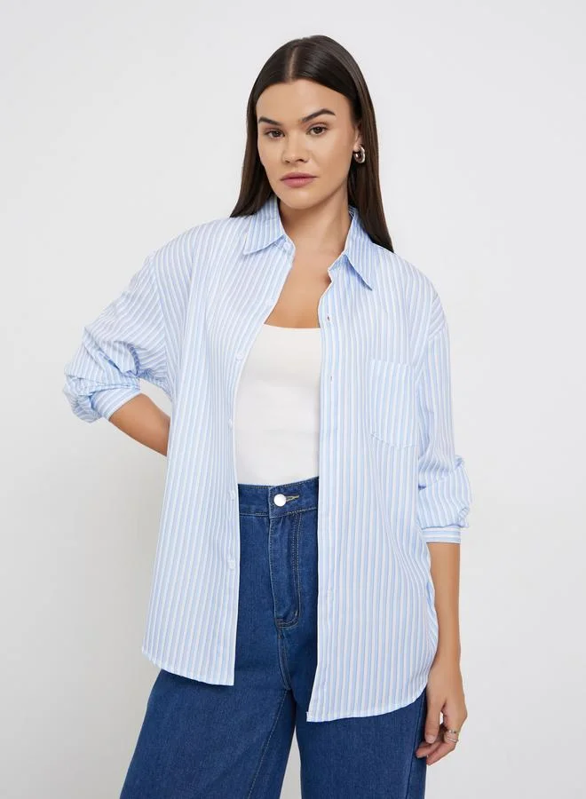 ستايلي بلوزة واسعة مخططة بأكمام طويلة