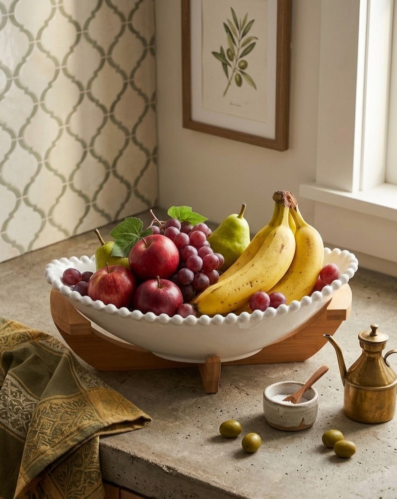An elegant oval porcelain fruit bowl with a wooden base that adds a modern and stylish touch to your serving table. - Image 2