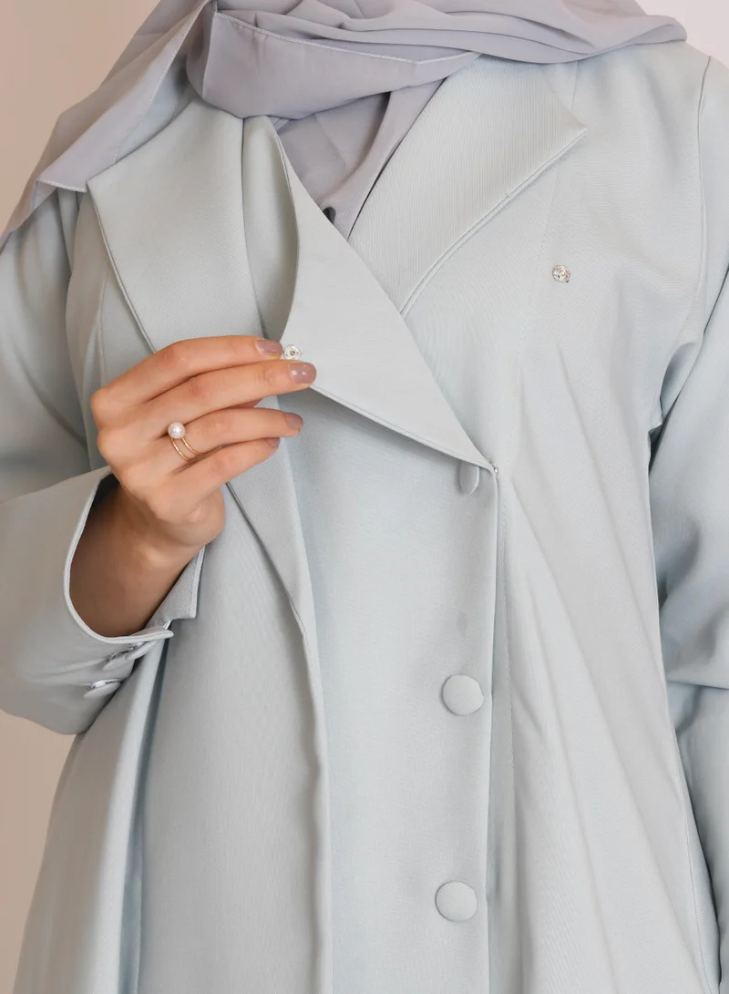 HAWRAA ABAYA Tiffany-colored blazer abaya with button closure and narrow sleeves decorated with buttons