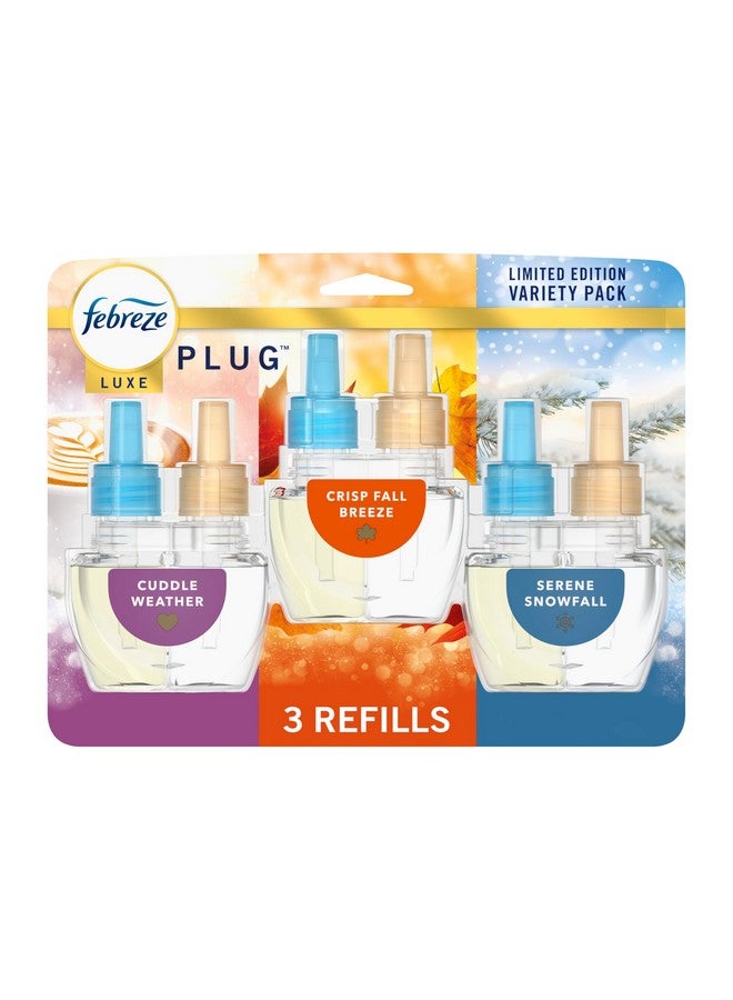 Febreze Plug In Air Freshener, Odor-Fighting Scented Oil Refill, Air Fresheners for Home and Bathroom and Kitchen, Long Lasting for Strong Odors, Premium Holiday Mix, 0.87oz Refills, 3 Count - Image 1