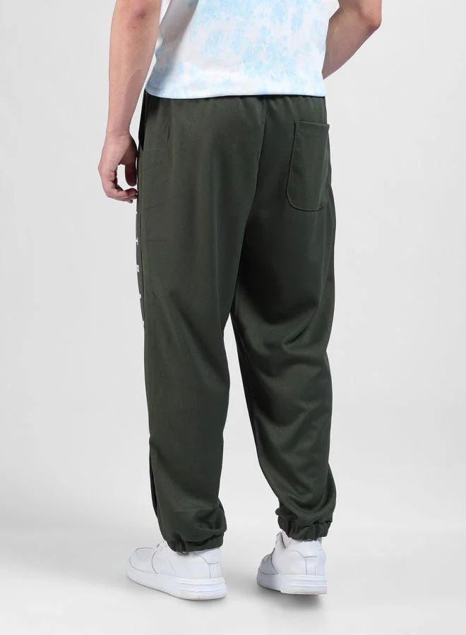 The Indian Garage Co Men Relaxed Fit Embroidered Side Pocket Mid-Rise Joggers