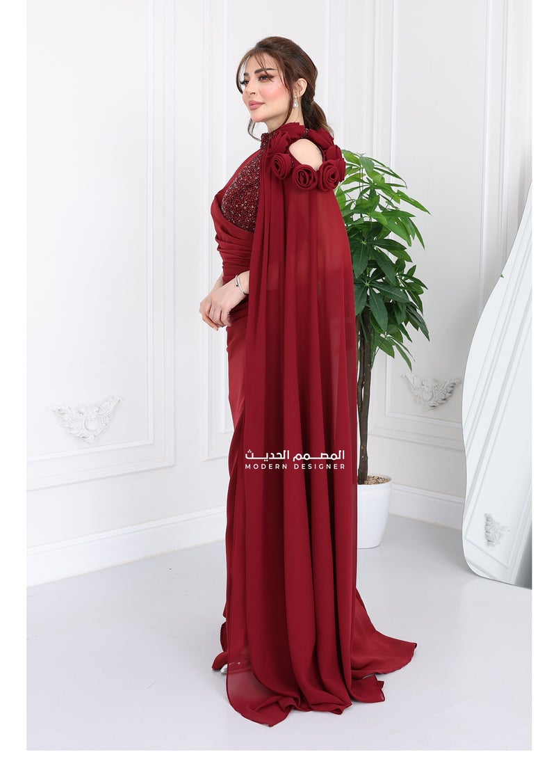 Modern Design An elegant and modern dress crafted from the finest soft and light crepe fabric, designed with elegant and sophisticated embroidery on the chest and neck, with a high embroidered collar that adds charming luxury. The special touch begins with the luxurious floor-length chiffon that gives you a royal presence, and with the prominent embroidered rose on the shoulder, you will appear in the most beautiful look for every occasion. And let's not forget the tastefully designed slit at the bottom of the dress, which adds soft femininity and imaginary appeal to every step you take. A modern design that caters to the taste of the modern Saudi woman who loves distinction in every detail. Want to appear with an eye-catching look that suits all occasions? This dress will be your first choice. - Image 2