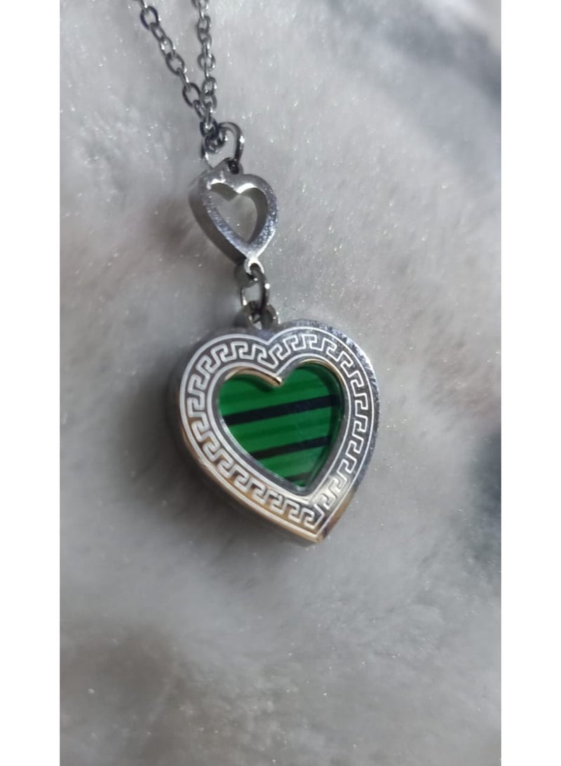 Luxuria A necklace featuring a heart-shaped pendant with a green malachite-like stone and a Greek key pattern. - Image 3