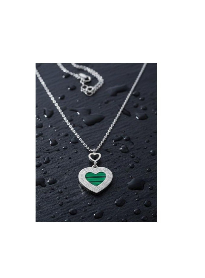 Luxuria A necklace featuring a heart-shaped pendant with a green malachite-like stone and a Greek key pattern. - Image 2