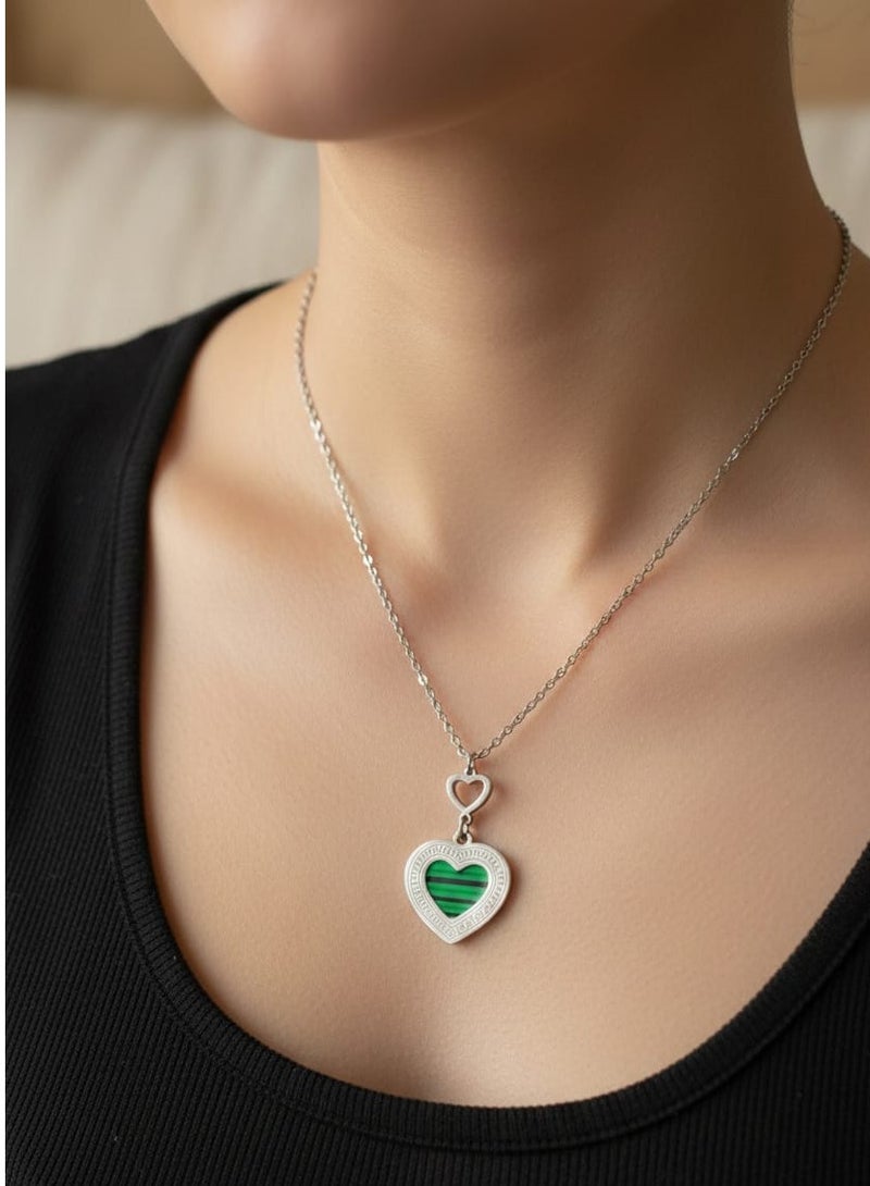 Luxuria A necklace featuring a heart-shaped pendant with a green malachite-like stone and a Greek key pattern. - Image 3