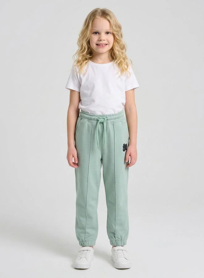 Girls Green Pintuck Details Printed Joggers By Juniorloom