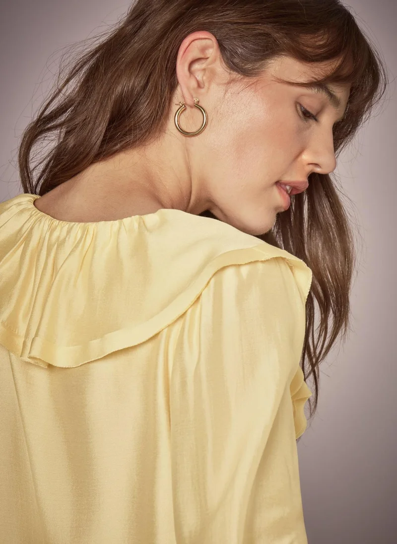 ماتلان بلوزة صفراء بكشكشة من إت يو