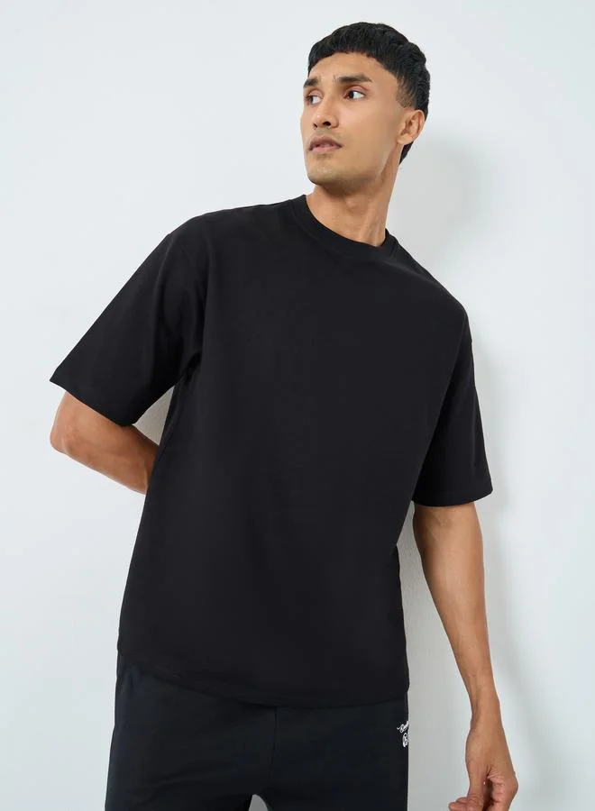 Styli Styli Men Graphic Print Interlock Oversized T-Shirt
