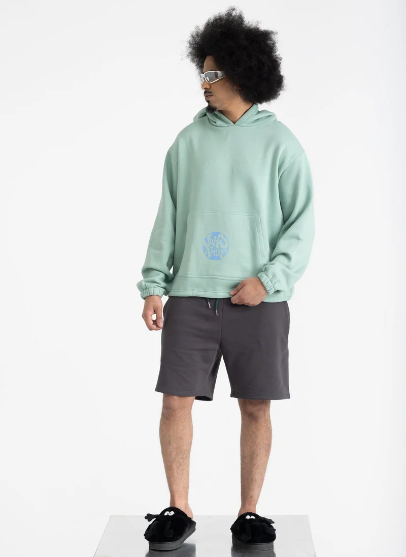 جوكس اسايد هودي بشعار أخضر باستيل