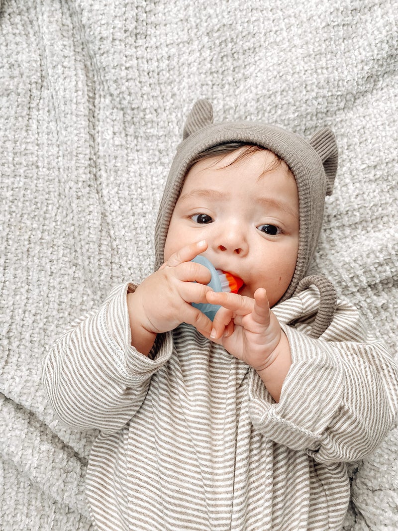 Itzy Ritzy Silicone Teensy Teether - Flexible, Soft & Hollow Baby Teething Toy with Easy-to-Hold Handle; Designed for Ages 3 Months and Up (Hero Pop) - Image 5