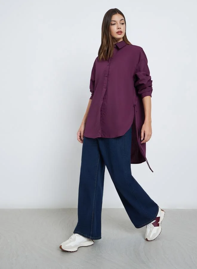 ستايلي بلوزة فضفاضة بتفاصيل شق جانبي