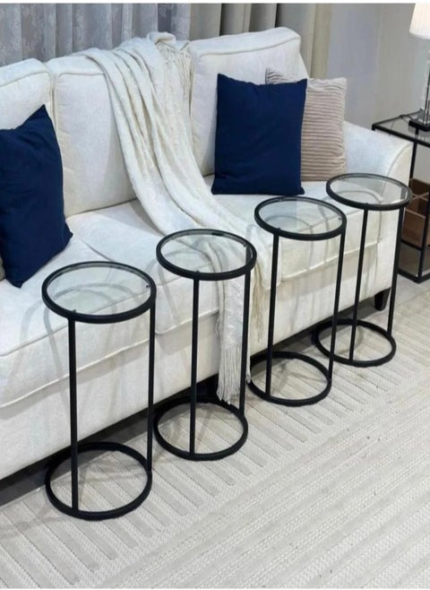 4-piece black iron and clear glass serving table set Add a touch of sophistication and modernity to your home with this 4-piece table set, featuring a design that combines strength and beauty. The black iron frame gives the set durability and stability, while the clear glass adds a luxurious and streamlined touch that suits all decor styles. Suitable for living rooms or small corners, it combines practicality and elegance in every detail.