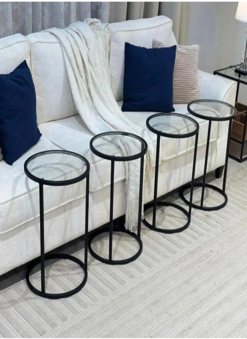 4-piece black iron and clear glass serving table set Add a touch of sophistication and modernity to your home with this 4-piece table set, featuring a design that combines strength and beauty. The black iron frame gives the set durability and stability, while the clear glass adds a luxurious and streamlined touch that suits all decor styles. Suitable for living rooms or small corners, it combines practicality and elegance in every detail.