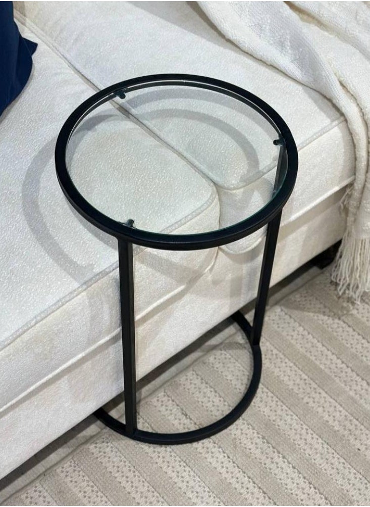 4-piece black iron and clear glass serving table set Add a touch of sophistication and modernity to your home with this 4-piece table set, featuring a design that combines strength and beauty. The black iron frame gives the set durability and stability, while the clear glass adds a luxurious and streamlined touch that suits all decor styles. Suitable for living rooms or small corners, it combines practicality and elegance in every detail.