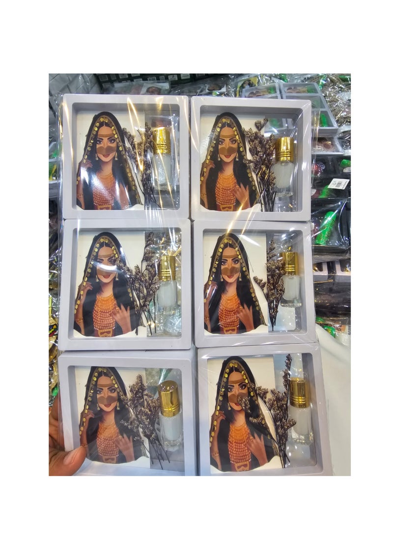 null - 12 ready-made giveaways, a frame containing musk, a card, and a flower, ready for distribution. - Image 1