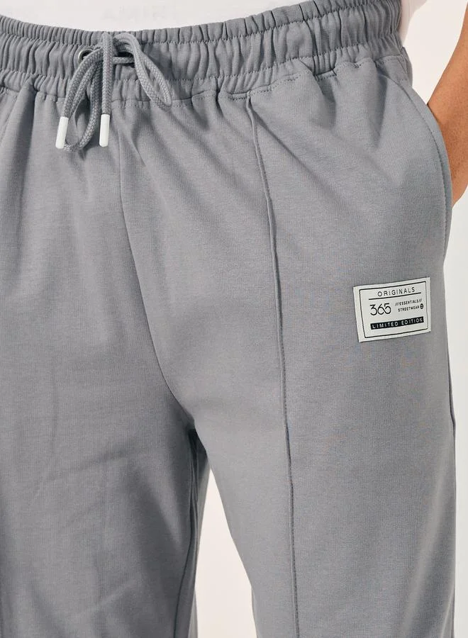 Styli Fleece Pintuck Wide Leg Joggers with Badge Detail