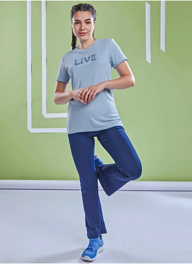 تكنوسبورت Graphic Print Crew Neck Short Sleeve Top by Styli