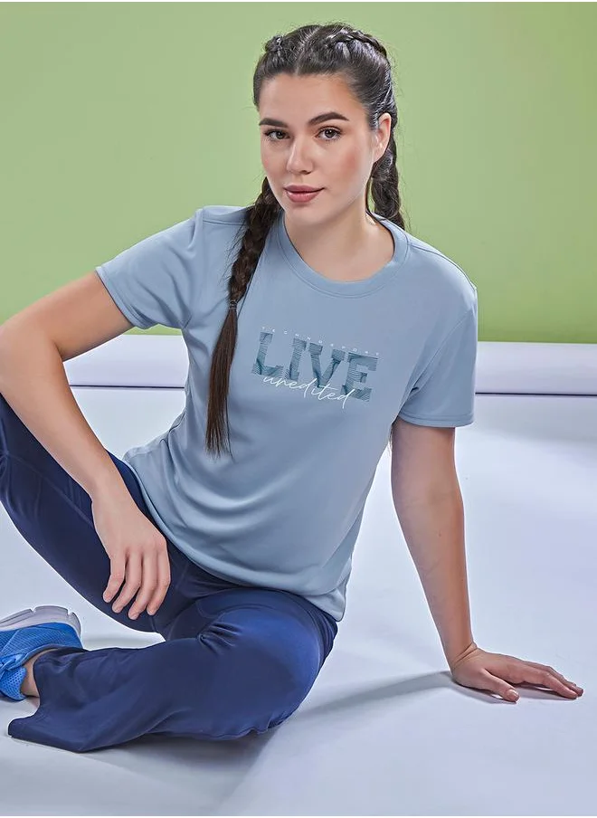 تكنوسبورت Graphic Print Crew Neck Short Sleeve Top by Styli