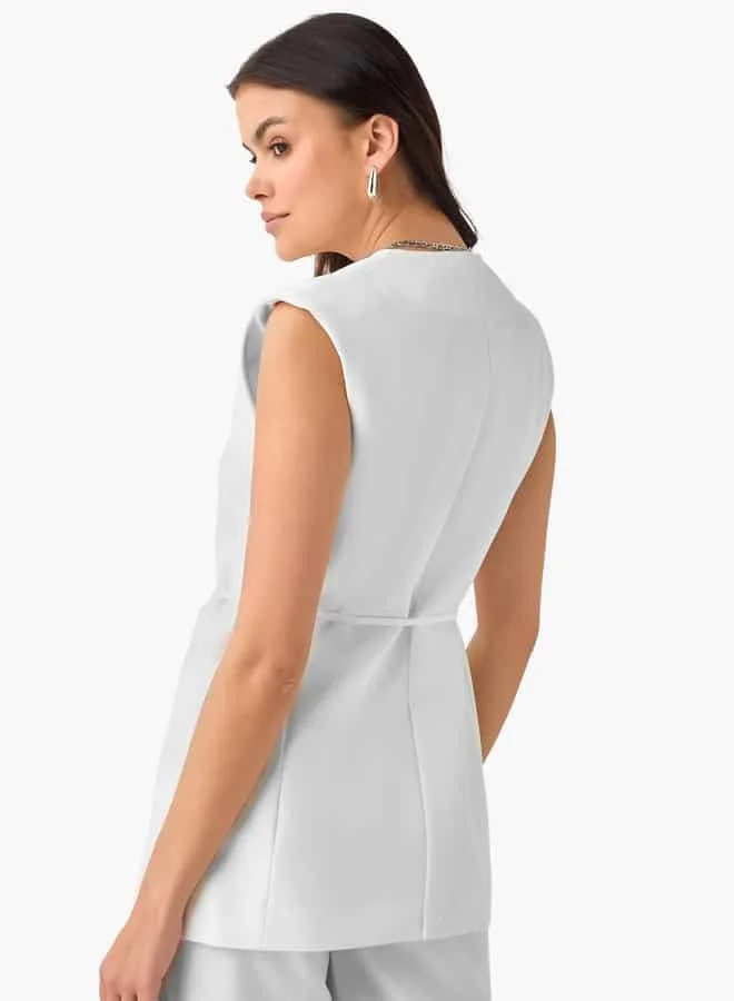 Iconic Sleeveless Jacket with Belt Detail