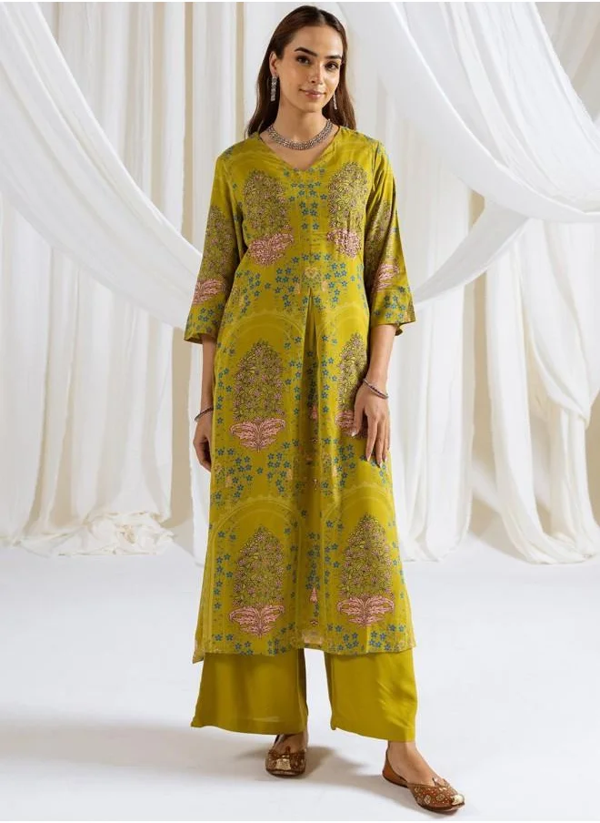 ISHIN Three-Fourth Sleeve Women Green Rayon Kurta Set with Embroidered pattern Tunic and Palazzo features a Round neckline and Three-Fourth Sleeve secured with Elastic closure and styled in Straight Fit ideal for Festive moments — designed to make heads turn.