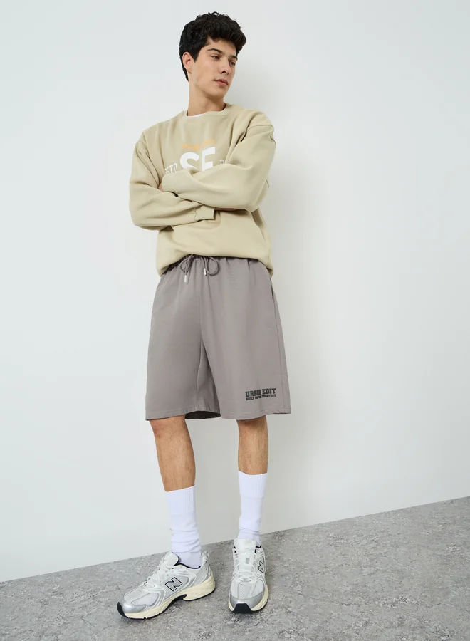 Styli Men Charcoal Placement Print Oversized Shorts