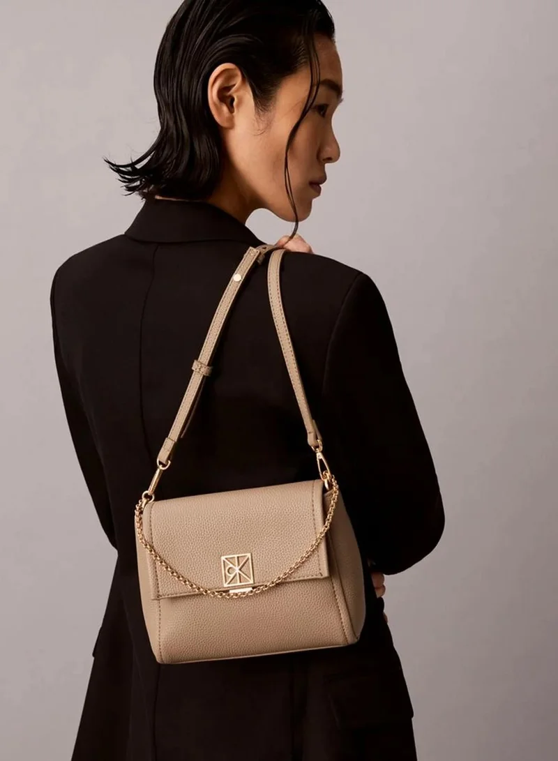 Calvin Klein Desert Taupe Pebble Grain Crossbody Bag for Women | Best Price UAE