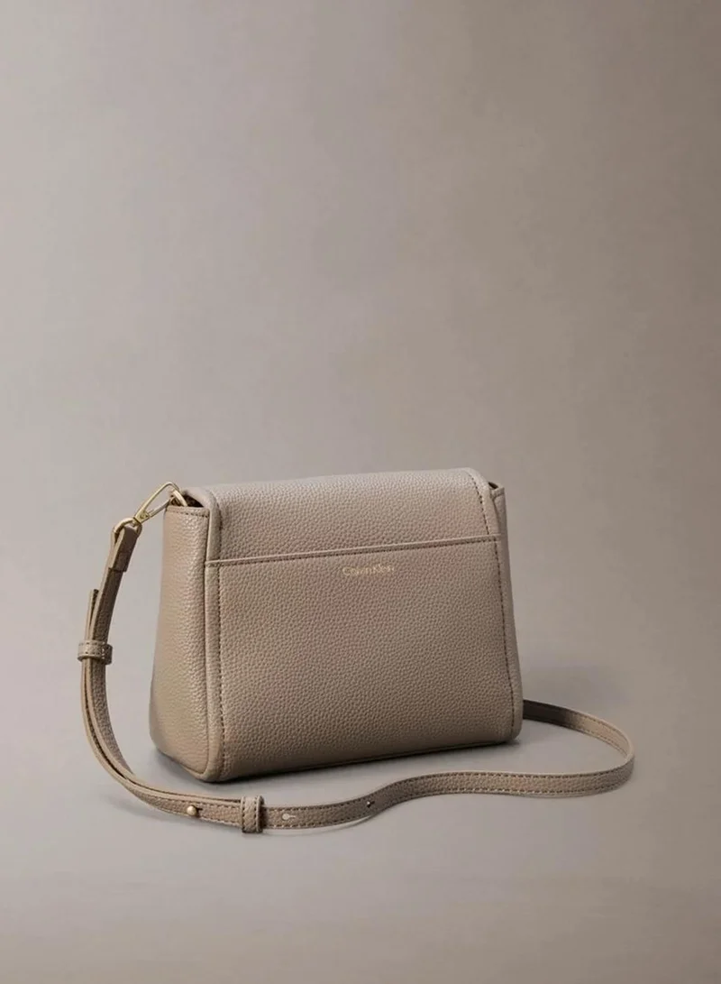 Calvin Klein Desert Taupe Pebble Grain Crossbody Bag for Women | Best Price UAE