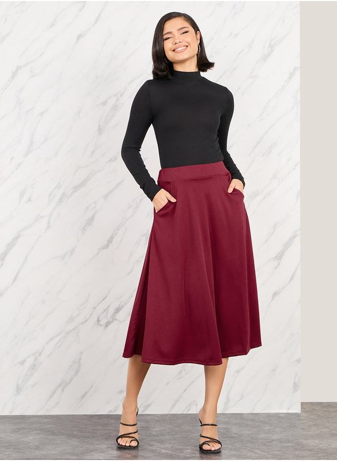 Styli - Solid Elastic Waistband A-Line Midi Skirt with Pocket Detail - Image 1