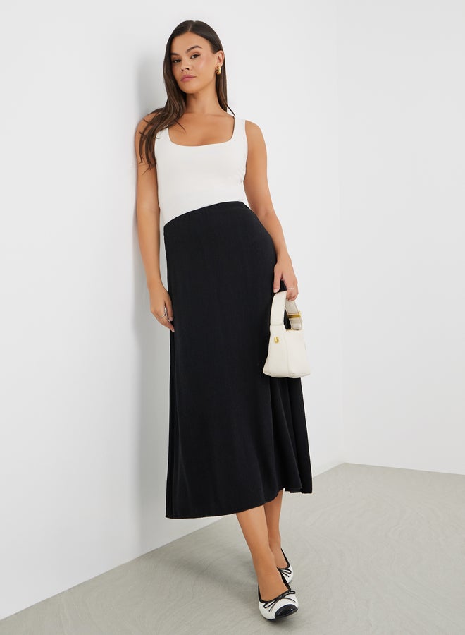 Styli Solid Mid Rise A-Line Midi Skirt - Image 1