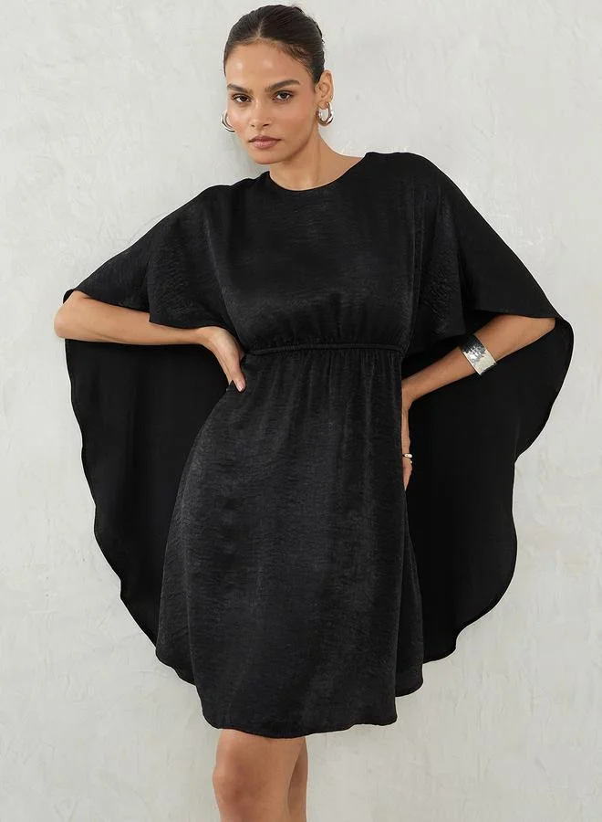 Femmella  Black Satin Cape Sleeve Mini Dress for Women | Best Price UAE