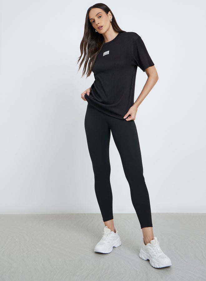 ستايلي تيشيرت نسائي أسود مقلم فضفاض - Image 2