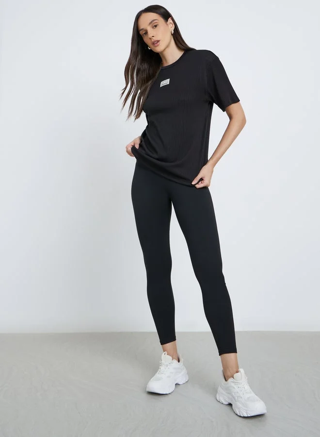 Styli Women Black Ribbed Oversized T-Shirt