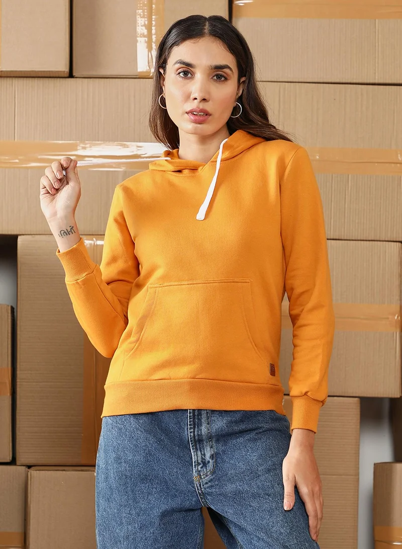 Campus Sutra Women's Mustard Yellow Solid Pullover Hoodie For Casual Wear | Hooded Neck | Long Cuffed Sleeves | Pull On Closure | Sweatshirt Crafted With Comfort Fit For Everyday Wear