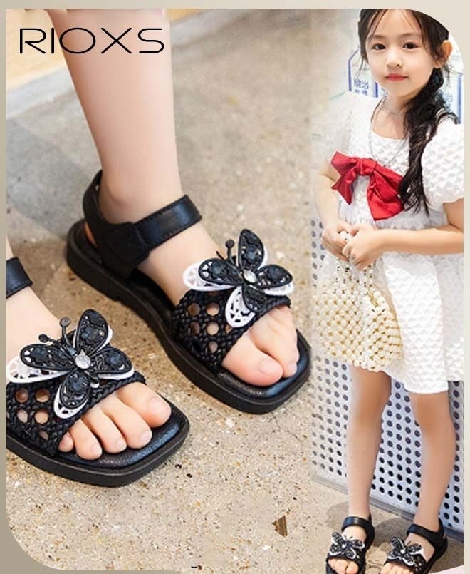 RIOXS Little Girls Flat Sandals, Dressy Ankle Strap Sandal for Kids Girls, Open Toe Slides Flats Butterfly Sandals, Anti-slip Toddler Baby Girls' Comfort Shoes, Little Princess Dressy Sandals for Wedding/ Party/ School, Floral Sandals Dress Sandals for Daily Wear, Stylish Vacation Sandals, Fashion Footwear Black - Image 1