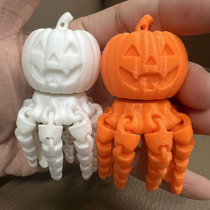 Halloween Ghost Pumpkin Glow-in-the-Dark Rotating Keychain Stress Relief Toy - Image 1