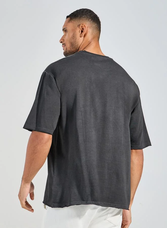 Styli Overdyed Washed Oversized T-Shirt with Raw Edge Sleeve