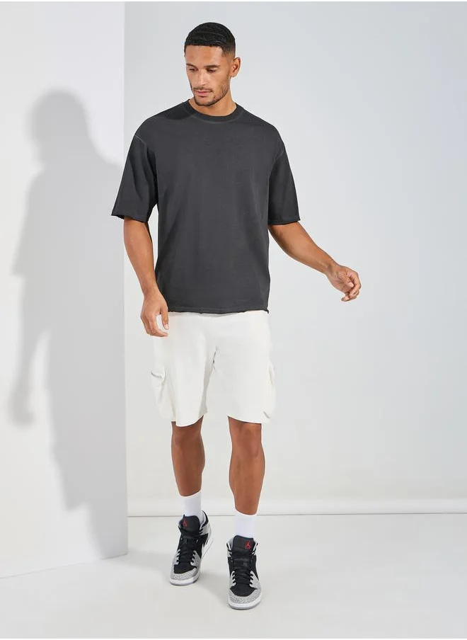 Styli Overdyed Washed Oversized T-Shirt with Raw Edge Sleeve