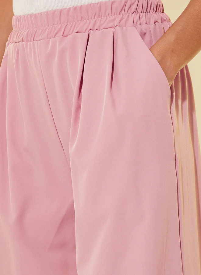 تايك تو بنطلون فضفاض بكسرات سادة