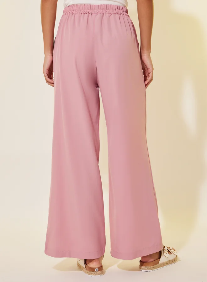 تايك تو بنطلون فضفاض بكسرات سادة