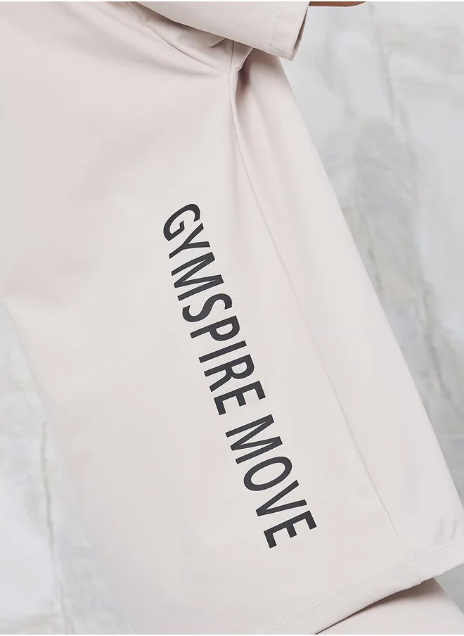 ستايلي Gymspire Edition - Label Side Vertical Text Loose Fit Yoga Top