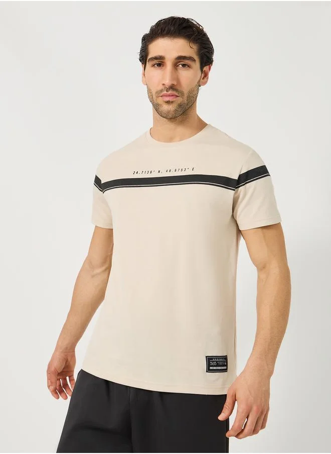 Styli Styli Contrast Panel Slogan Print Regular Fit T-Shirt with Badge Detail