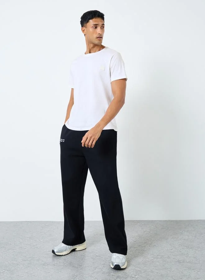 Styli Styli Men Black Slogan Print Oversized Joggers