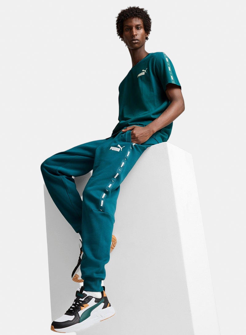 PUMA ESS+ Tape Sweatpants FL cl - Image 1