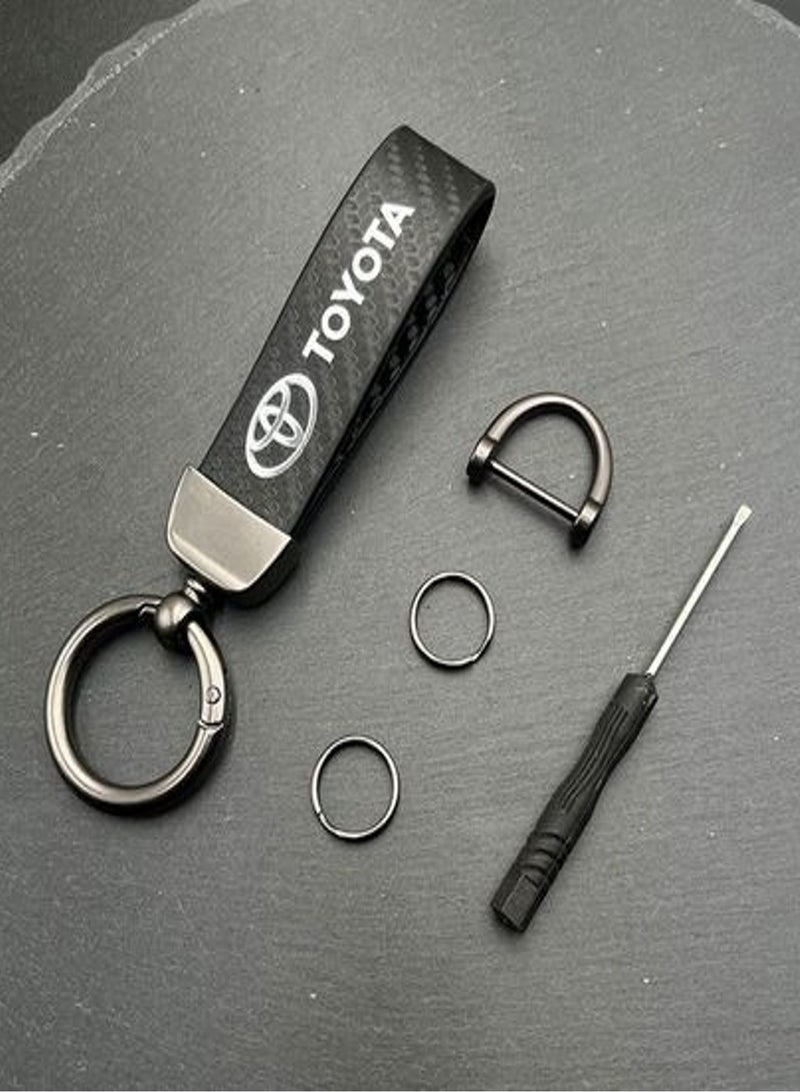 سلسلة مفاتيح جلدية بنمط ألياف الكربون لسيارة تويوتا، سلسلة مفاتيح تناسب سلسلة معدنية من سبائك معدنية، ملحقات تزيين وتصميم سلسلة مفاتيح مع شعار هدية للنساء والرجال باللون الأسود - Image 2