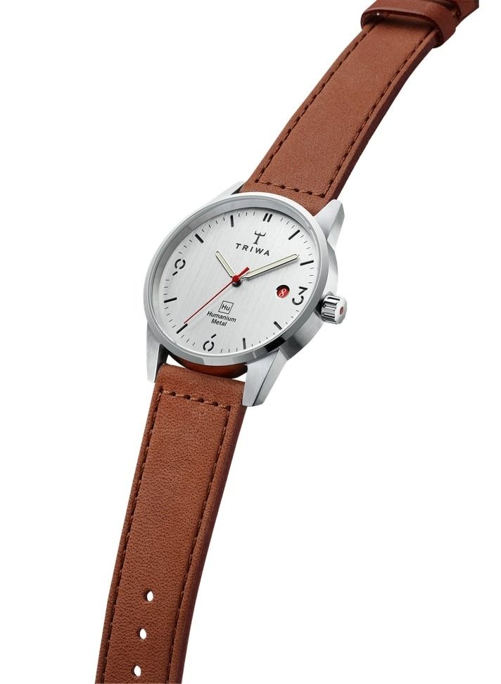 TRIWA Humanium 39 Brown Sewn Color Classic Unisex Watch Quartz Movement 5 atm Water Resistant Humanium Metal Case Tanned Leather Strap Polished Buckle Ladies Womens Fashion
