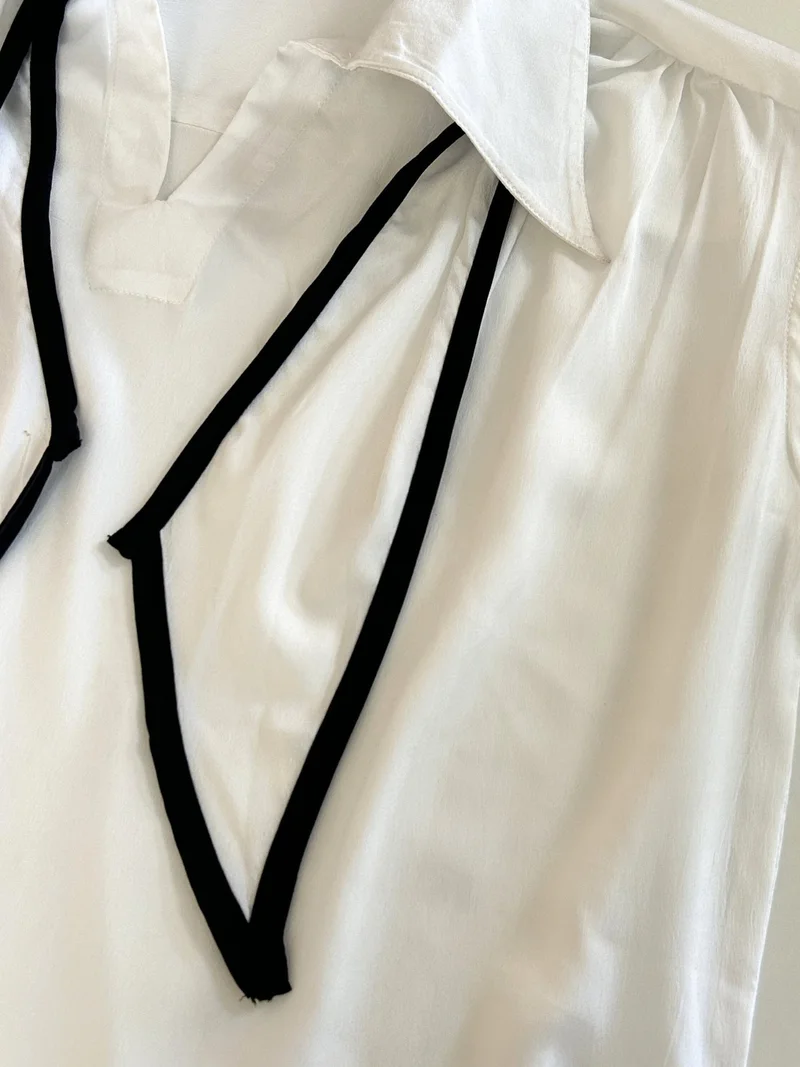 Outzidr  Off White Sleeveless Tie-Neck Blouse for Women | Best Price UAE